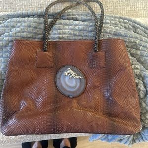 Genuine leather with stone and swavorski crystals. Was made by local artist